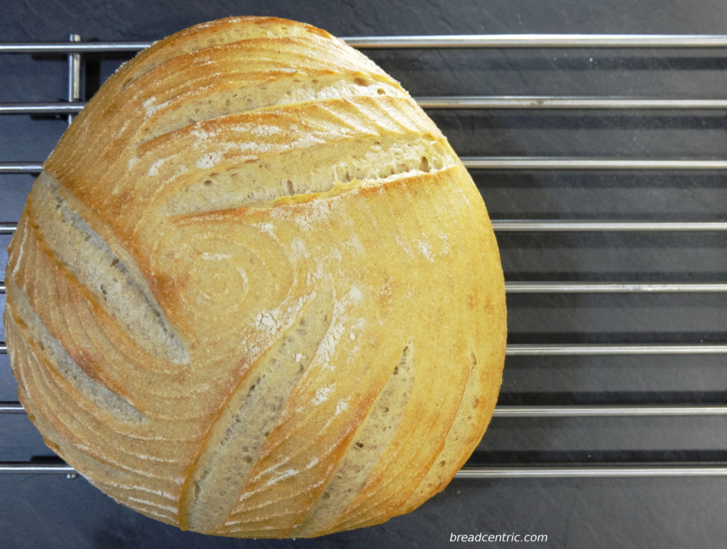 Tarzynkowy. Notice how triple scoring under the 120 degrees angle made the loaf expand into a triangular shape
