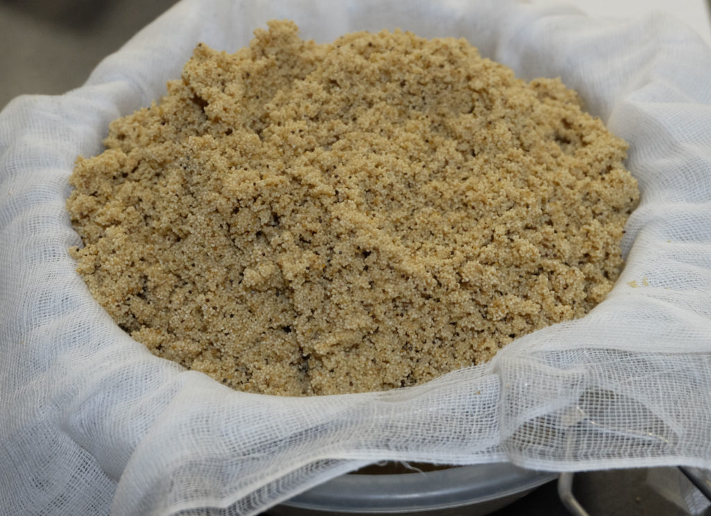 Removing water from cooked poppy